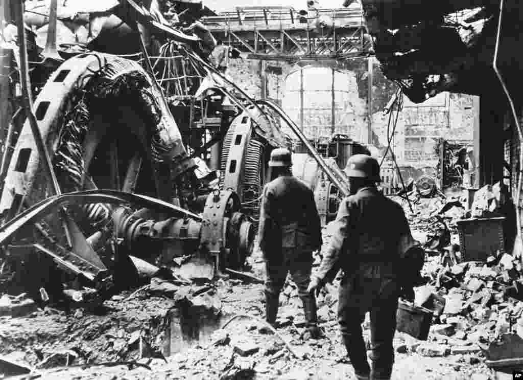 German troops passing through a wrecked generating station in the factory district of Stalingrad on December 28, 1942, where fierce fighting had been raging for months. (AP)