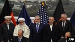 АКШ жана Ооганстан эки тараптуу коопсуздук келишимине кол койгон учур. Кабул, 30-сентябрь, 2014-жыл.