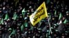 Female regime supporters are seen at Azadi stadium during the speech of the Iranian Supreme Leader Ayatollah Ali Khamenei in Tehran. The yellow banner says "Death to Israel". October 4, 2018.