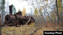 A locomotive slowly rusts away in the Siberian taiga decades after being abandoned there when an ambitious Soviet railway project was halted in 1953. (Photo: Stepan Cernousek)