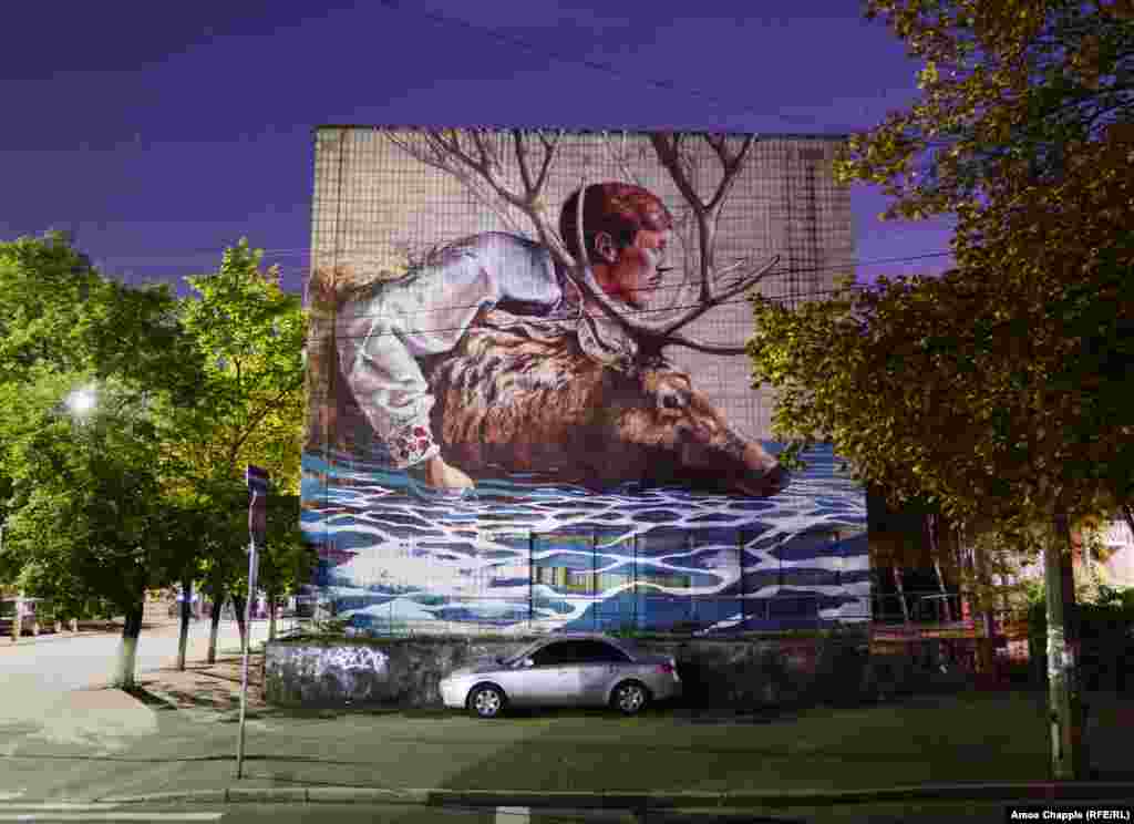 The River Crossing, by Australian artist Fintan Magee. The explosion of street art in Kyiv is partly a result of young locals like the Mural Social Club and Art United Us, who arrange for international artists to visit and work in Ukraine. 