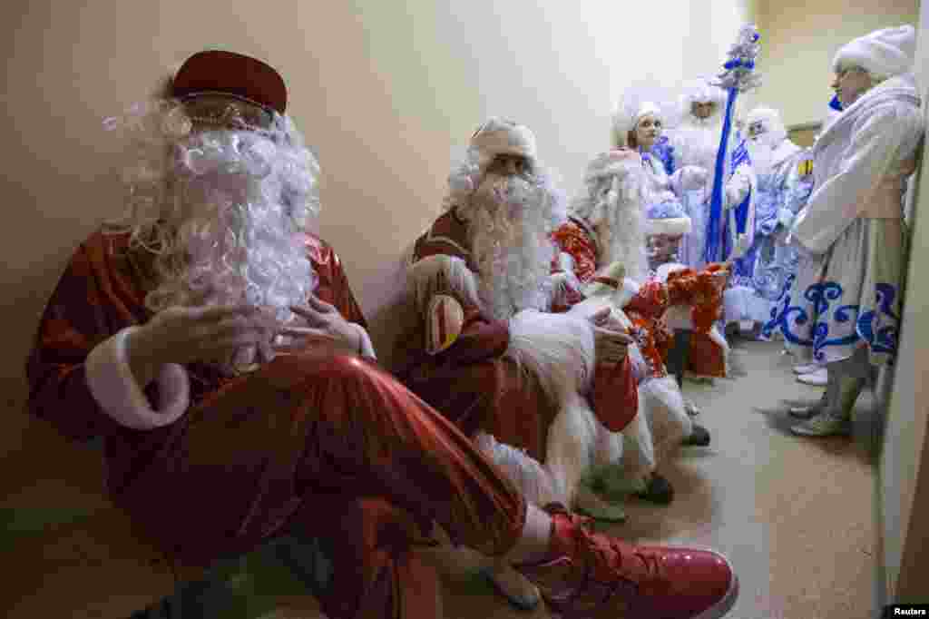 People dressed as Grandfather Frost and Snow Maiden taking part in a contest at a winter festival in Minsk. (Reuters/Vasily Fedosenko)