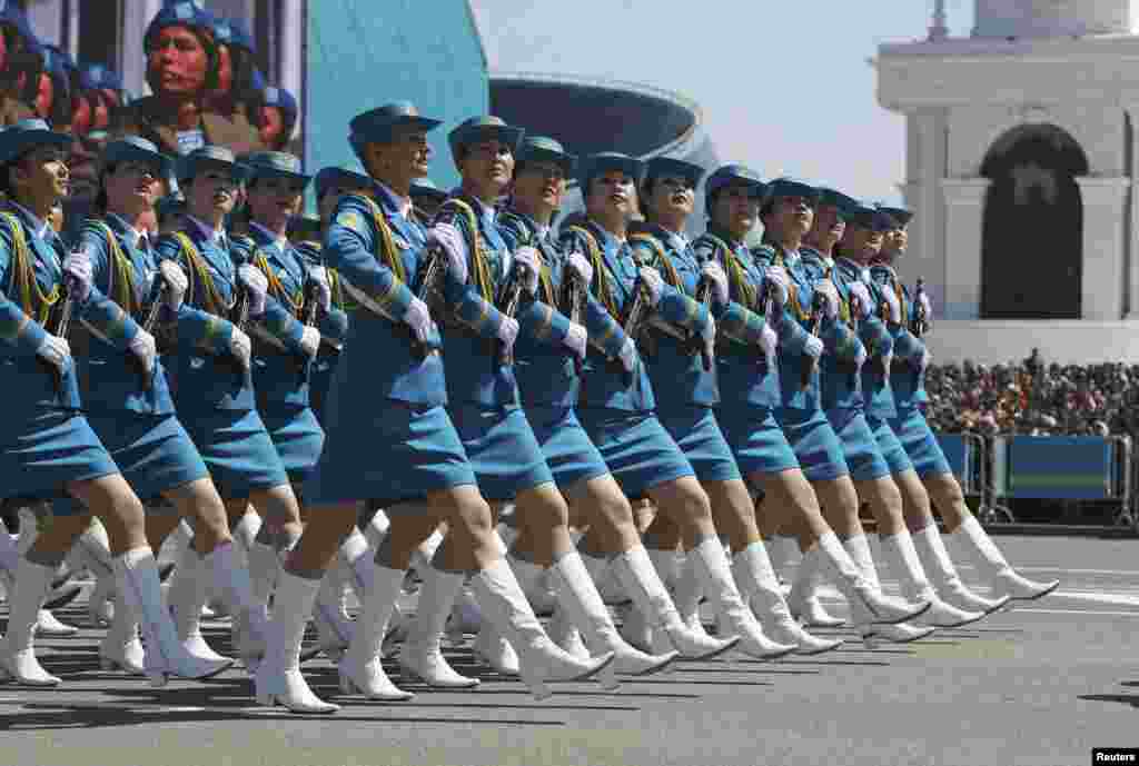 Female troops march during a parade of Kazakhstan's armed forces to mark the Defender of the Fatherland Day in Astana on May 7. (Reuters/Mukhtar Kholdorbekov)