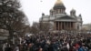 People surround St. Isaac's Cathedral on February 12 amid competing protests over transferring the famed St. Petersburg landmark to the Russian Orthodox Church. 