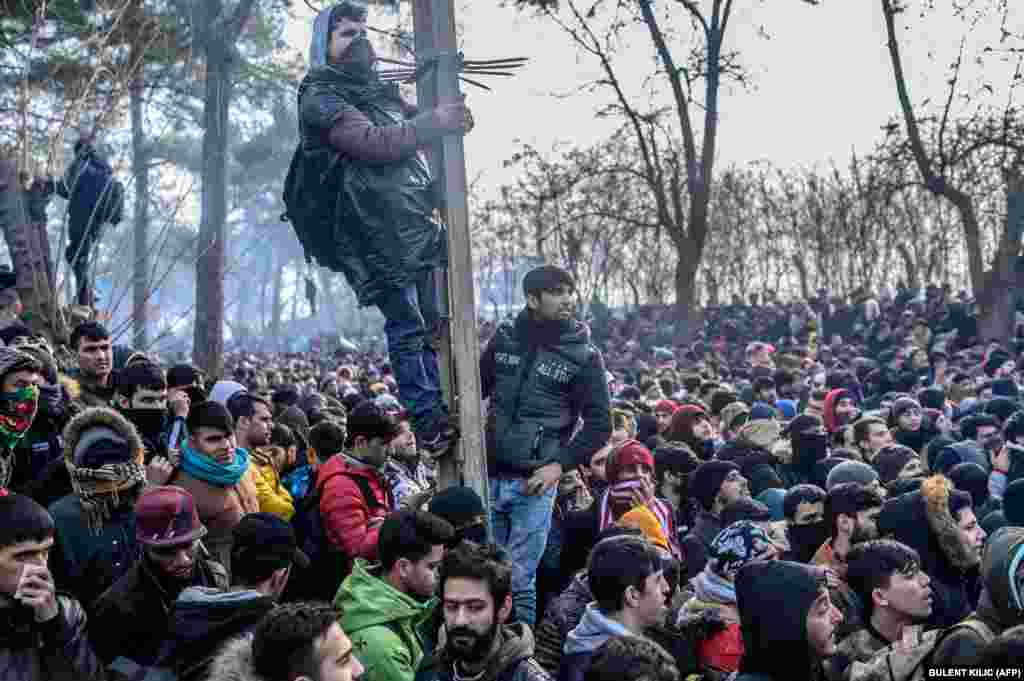 Migrants gather inside the buffer zone of the Turkey-Greece border, at Pazarkule, in the Edirne district, on February 29.