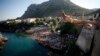 Diver Lorens Listo jumps from the center of Mostar&#39;s Stari Most, or Old Bridge. Diving competitions have been held here since the bridge was built 447 years ago, although the current formal competition dates back only to 1968.