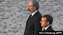 French President Emanuel Macron (foreground) made his comments in a statement detailing a call with Armenian Prime Minister Nikol Pashinian. (file photo)