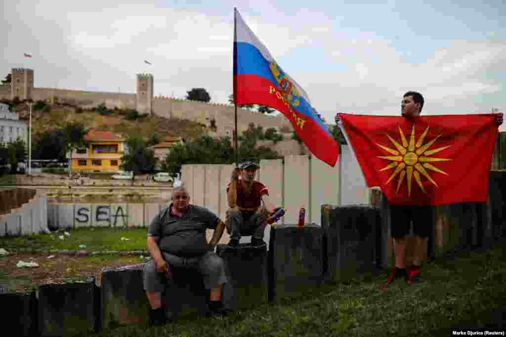 Protesters hold Russian and Macedonian flags in a protest ahead of Skopje's compromise with Athens on a new name for the country: Republic Of North Macedonia.