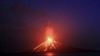 A photo taken with a slow shutter speed shows lava streams down the Mt. Anak Krakatau volcano during an eruption as seen from Rakata island in Lampung Province, Indonesia. (EPA-EFE/Ghazali)