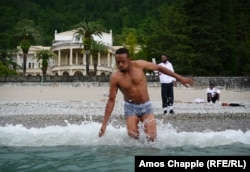 Samaliland player Abbikarim Hirsi takes a dip in the Black Sea on his first trip away from his homeland.