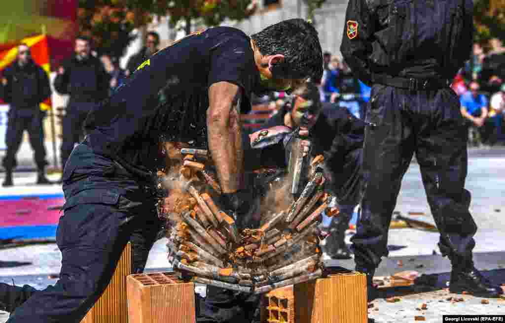 Macedonian soldiers perform to mark NATO Day in the main square in the capital, Skopje. Macedonia is not a member of NATO but Macedonian soldiers participate in NATO missions in Iraq and Afghanistan. (epa-EFE/Georgi Licovski)