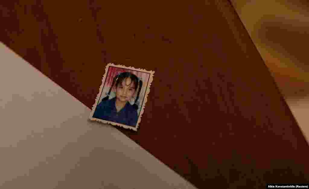 The photo of an unidentified girl is placed on a desk inside the compound. 