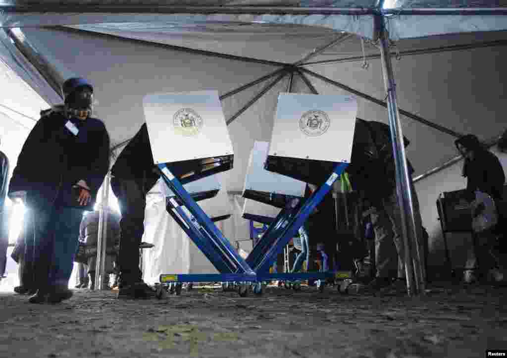 Voters cast their ballots at a polling station set up for residents of Queens, New York, after the original site was damaged by superstorm Sandy.