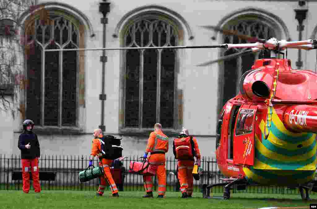 An air ambulance lands in Parliament Square following the incident.&nbsp;