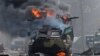 Ілюстраційне фото: підпалений російський бронетранспортер (БТР), 27 лютого 2022 року