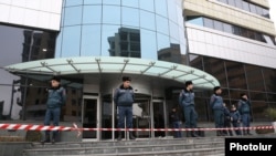 Armenia -- Police officers guard the entrance to the Erebuni Plaza Business Center after a gunman opened fire there, Yerevan, January 23, 2020. 