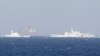 Китайская буровая платформа Shi You 981 в окружении кораблей береговой охраны Китая – в 210 километрах от берегов Вьетнама, 14 мая 2014 г. 