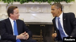 U.S. - U.S. President Barack Obama and British Prime Minister David Cameron (L) meet in the Oval Office of the White House in Washington, 20Jul2010