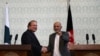 Pakistani Prime Minister Nawaz Sharif (L) shaking hands with Afghan President Ashraf Ghani in Kabul on May 12.
