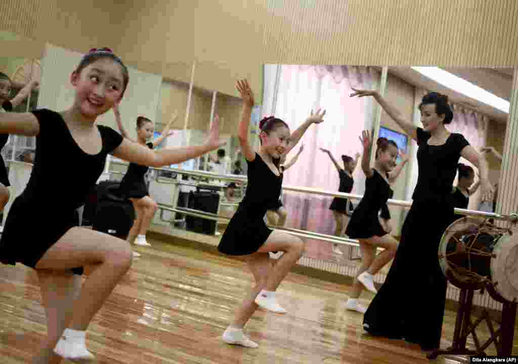 Girls dance in a studio at the Mangyongdae Children&#39;s Palace in Pyongyang, North Korea. Mangyongdae Children&#39;s Palace is for talented schoolchildren to attend extracurricular classes and a popular place for tourists to visit during their stay in the capital. (AP/Dita Alangkara)