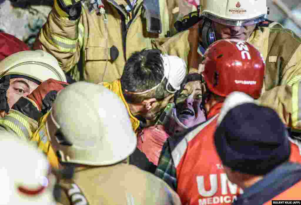 Turkish woman Arzu Tekgoz is rescued at the site of a building that collapsed in Istanbul&#39;s Kartal district on February 6. (AFP/Bulent Kilic)