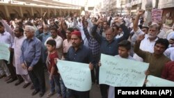 Pakistanis in Karachi rally in the aftermath of the deadly mosque shootings in New Zealand.
