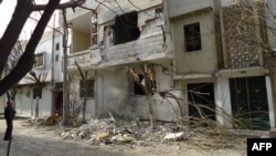 A damaged building in the Bab Amr neighborhood of the flashpoint city of Homs shows signs of the violence there.