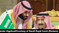 FILE: Saudi Arabia's Crown Prince Mohammed bin Salman talks with Saudi Arabia's King Salman bin Abdulaziz Al Saud during the Gulf Cooperation Council's (GCC) Summit in Riyadh in December 2018.