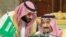 FILE: Saudi Arabia's Crown Prince Mohammed bin Salman talks with Saudi Arabia's King Salman bin Abdulaziz Al Saud during the Gulf Cooperation Council's (GCC) Summit in Riyadh in December 2018.