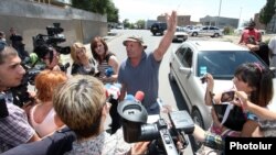 Armenia -- An official from the Proshian village administration explains his resignation to the reporters, 29 Jul2013.