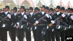 Iranian Revolutionary Guards march during a military parade marking Iran's eight-year war with Iraq in Tehran.