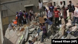 Rescue efforts after another of Karachi's building collapsed on March 5.