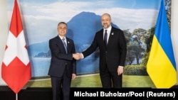 Swiss President Ignazio Cassis welcomes Ukrainian Prime Minister Denys Shmyhal to the Ukraine Recovery Conference in Lugano, Switzerland, on July 4.