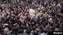 Iran -- Mourners carry the coffin of Amin Karimi, a member of Iranian Revolutionary Guards who was killed in Syria, during his funeral in Tehran, October 28, 2015