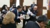 Armenia - Marina Khachatrian of the opposition Yerkir Tsirani party is confronted by pro-government members of Yerevan's municipal assembly, 13 February 2018.