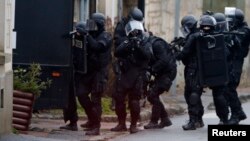France -- French special intervention police conduct a house-to-house search in Longpont, northeast of Paris, January 8, 2015