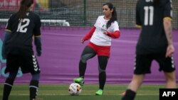 Former Afghanistan women's football captain Khalida Popal (center) has spoken out previously about the discrimination women players face.