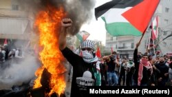 Protesters are seen near the U.S. embassy in Awkar, near Beirut, Lebanon