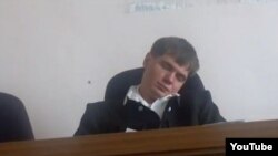 Judge Yevgeny Makhno of Blagoveshchensk city court dozes off in court during a hearing in August 2012.