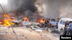 Սիրիա - Դամասկոսում պայթյունից հետո մեքենաներ են այրվում, 21-ը փետրվարի, 2013թ.