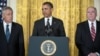 U.S. President Barack Obama is flanked by his nominees for CIA director, John Brennan (right), and defense secretary, Chuck Hagel, in Washington on January 7.