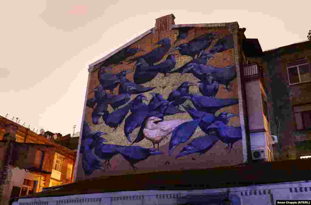 A mural by Alexander Britz in the courtyard where three famous crows -- named Cyril, Carlos, and Corbin -- are housed in a cage.&nbsp;