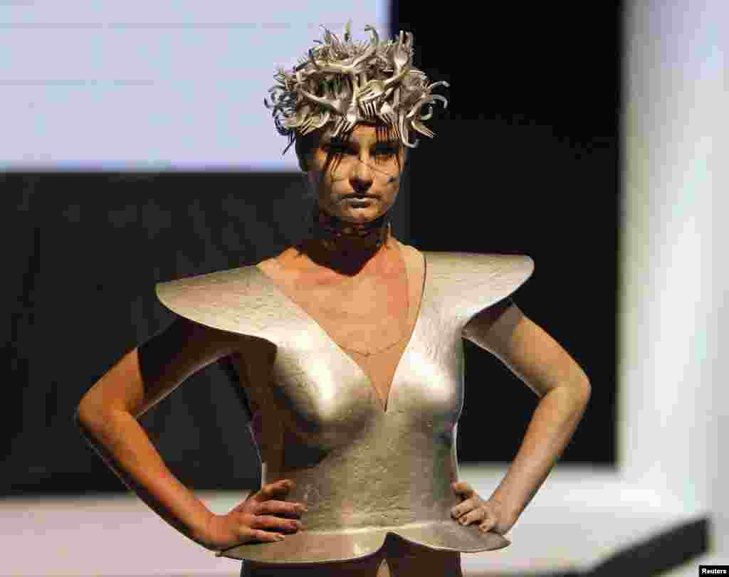 Karina Kasenova was reponsible for this futuristic garb. 