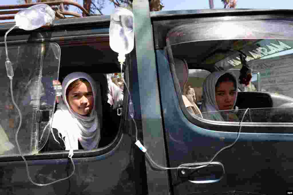 Afghan schoolgirls receive medical treatment outside a local hospital in Herat after being admitted for symptoms of poisoning. According to reports, more than 300 Afghan schoolgirls are suffering from suspected gas poisoning, the third incident in Herat in a week. Authorities have launched an investigation into the incident to determine if that was a deliberate act by sympathizers of the Taliban, who oppose women's education. (epa/Jalil Rezayee)