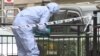 A forensics officer gathers evidence at the scene of a terror attack in central London on the evening of June 3 that killed seven people.