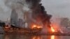 A ship is pictured engulfed in flames at the port of Beirut following a massive explosion that hit the heart of the Lebanese capital on August 4, 2020