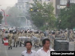 Iranian riot police patrol a street in Tehran, during protests of supporters of Mahmoud Ahmadinejad's opposing candidate Mir Hossein Musavi, Tehran, June 2009