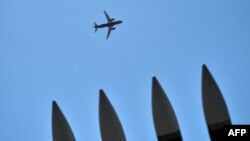 A Russian Sukhoi Superjet 100 flies over an air show in Moscow (file photo).