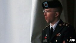 Private First Class Bradley Manning is escorted from a hearing in Fort Meade, Maryland in January.