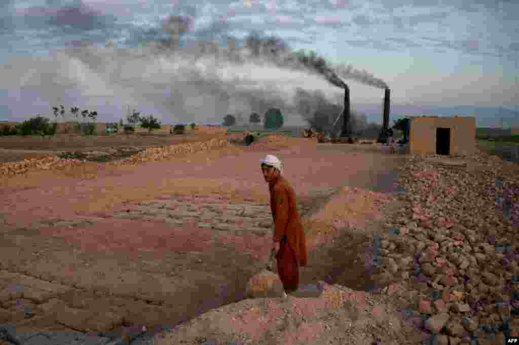 An Afghan laborer works at a brick factory on the outskirts of Mazar-e Sharif. (AFP/Farshad Usyan)